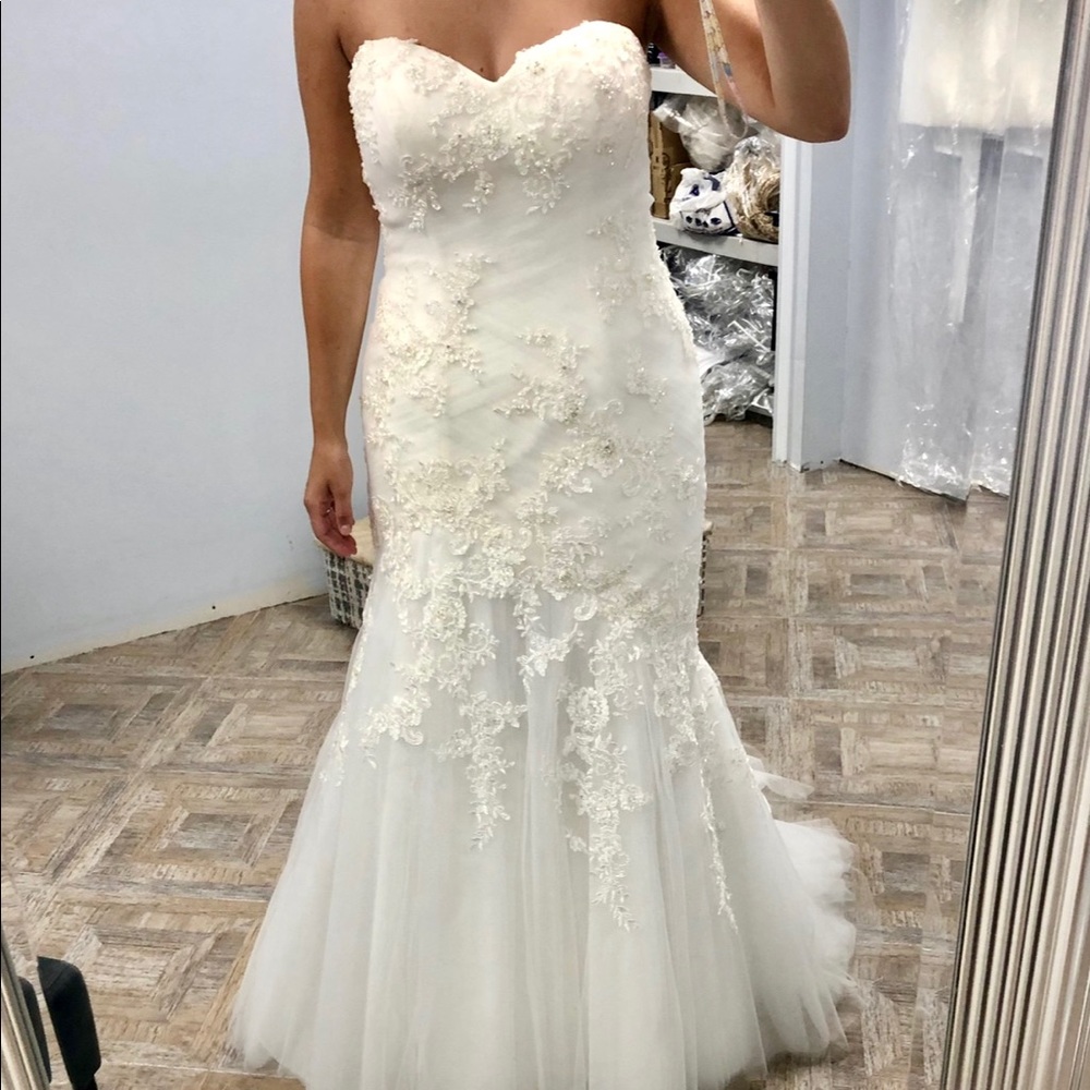 Asymmetrical strapless wedding gown